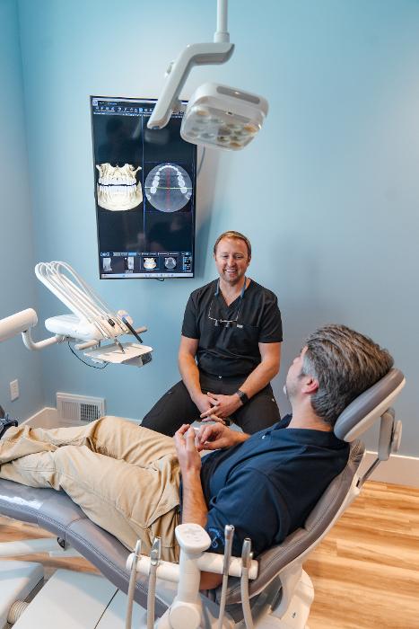 family dentist surf city | Dr. Parr with patient