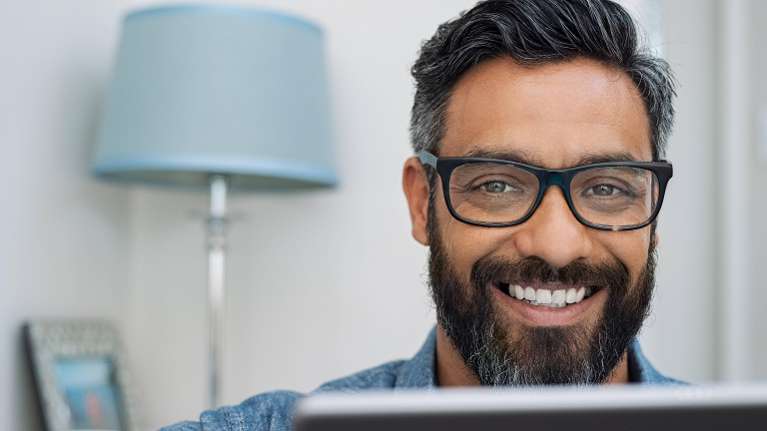 hybrid dentures hampstead | man smiling