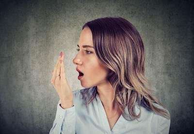 a woman with Bad Breath in Surf City. NC