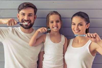 A family brushing their teeth in at Surf City, NC