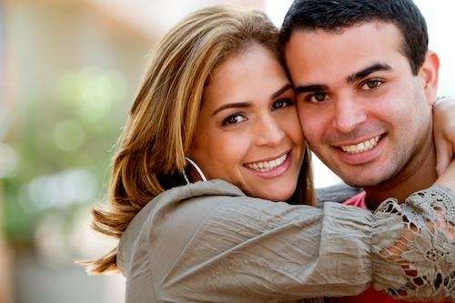 A couple after a Cosmetic Dentistry At Surf City Dental