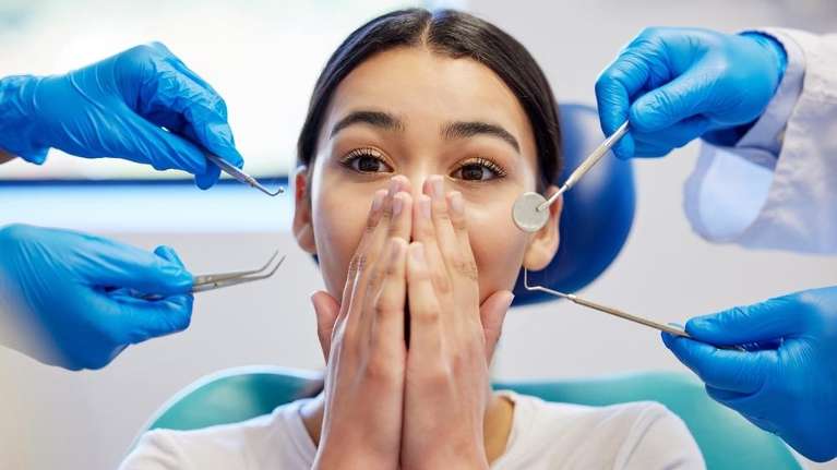 woman with dental anxiety at dentist