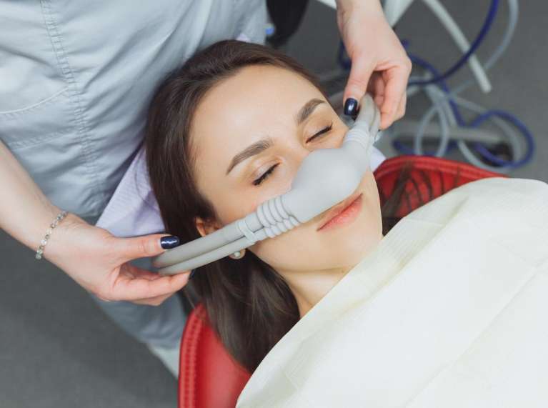surf city dentist | Patient receiving nitrous oxide