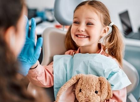 children's dentist surf city | kid at dentist