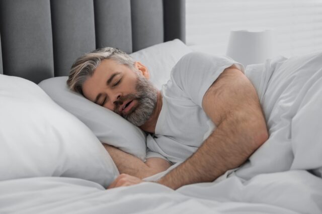 man snoring while sleeping