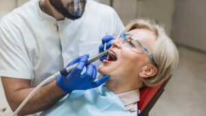 woman receiving dental cleaning